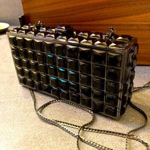 Black bejewelled handbag with metal closure and serpentine, optional chain